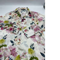 White long-sleeved shirt with floral pattern 
