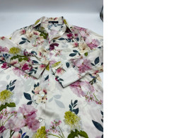 White long-sleeved shirt with floral pattern 