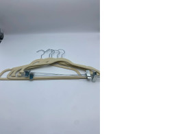 Set of 5 Cream colored clothes hanger with clips 