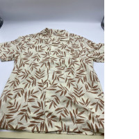 Cream colored Hawaiian shirt for kids with brown leaf pattern 