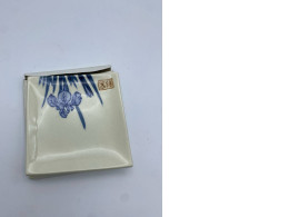 White square saucer with blue floral pattern 