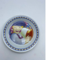 White plate with a pattern of children and dogs 