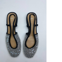 Women's silver and black closed toe shoes