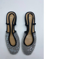 Women's silver and black closed toe shoes