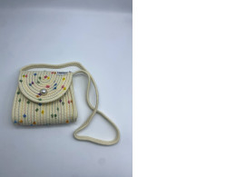 Women's cream colored shoulder bag with floral pattern Women's cream colored shoulder bag with floral pattern