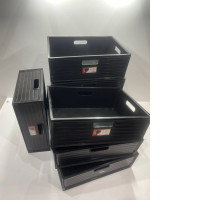 Set of black plastic boxes