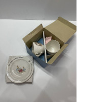 Set of teacups and plate with rabbit print