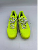 Yellow tennis shoes