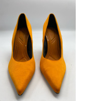 Orange hilled shoes