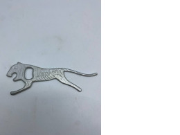 Iron bottle opener in the shape of a cat