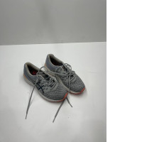 Secondhand grey sneakers