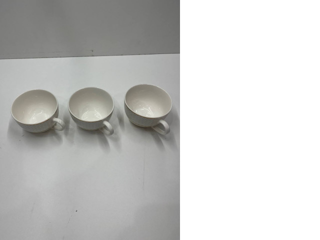 Set of white teacups Set of white teacups