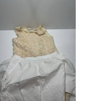 Girl's summer suit: beige t-shirt and white skirt Girl's summer suit: beige t-shirt and white skirt