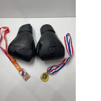 Black boxing gloves with medals