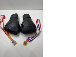 Black boxing gloves with medals