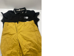 Boy's summer suit: yellow shorts and black polo Boy's summer suit: yellow shorts and black polo