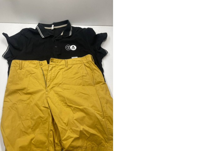 Boy's summer suit: yellow shorts and black polo Boy's summer suit: yellow shorts and black polo
