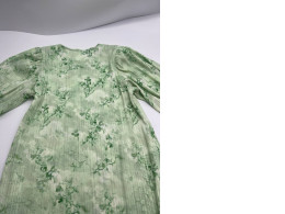 Green girl's dress with pattern