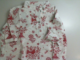Beige shirt with red pattern Beige shirt with red pattern
