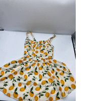 White tank top and short skirt dress with orange pattern