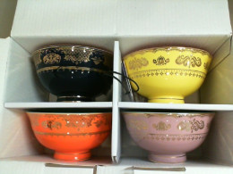 Set of 4 ceramic mugs. multi-colored