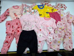 Set of 8 Girls' shirts and pants have patterns.