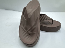 Cream-colored flip-flops