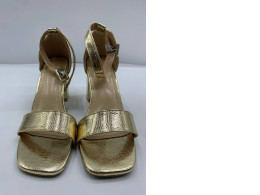 Gold women's hilled shoes