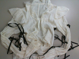 white blouse with black laces