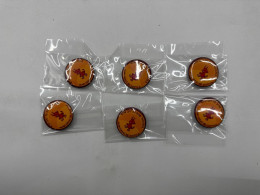 Set of orange pins with devil