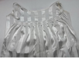 Women's white tank top and shorts with silver stripes