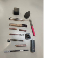 Makeup set, two sponges, six pencils, lipstick, lip gloss, two foundation creams, pencil sharpener