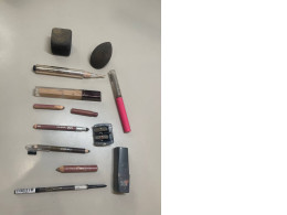 Makeup set, two sponges, six pencils, lipstick, lip gloss, two foundation creams, pencil sharpener