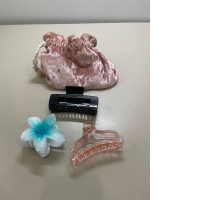 set of three hair clips and a bag for them