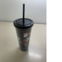 Plastic cup with a straw