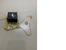 set of decorative jewelry chain and ring complete with box and pouch