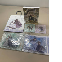 The Fei Tian - Dinghai Fusheng Collector's Set includes a book, two sets of character figurines two badges, and a gift bag.