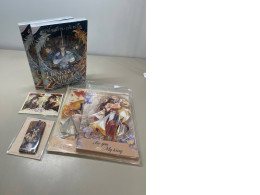 Gift set including a collection of two books, two sets of character figurines, two photocard and a magnet Gift set including a collection of two books, two sets of character figurines, two photocard and a magnet