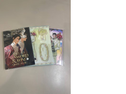 The set includes a book and two acrylic photographs