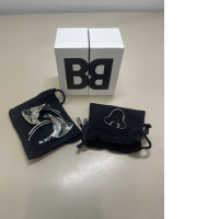 set of two decorative earrings and a nose ring complete with bags and a box