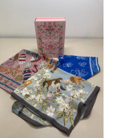 set of three scarves and a decorative box