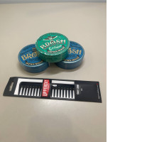 a set of three hair styling gels with a comb