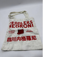 White cloth bag with red pattern 