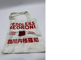 White cloth bag with red pattern 