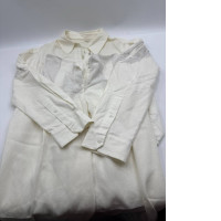 Women's white long-sleeved shirt and white trousers