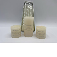 Set of 4 White column candles decorate the dining table. 