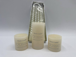 Set of 4 White column candles decorate the dining table. 