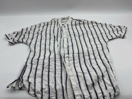 Round neck shirt with white buttons and black stripes 