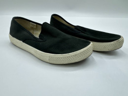 Black slip-on sneakers for men