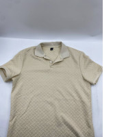 Cream-colored short-sleeved collared T-shirt Cream-colored short-sleeved collared T-shirt